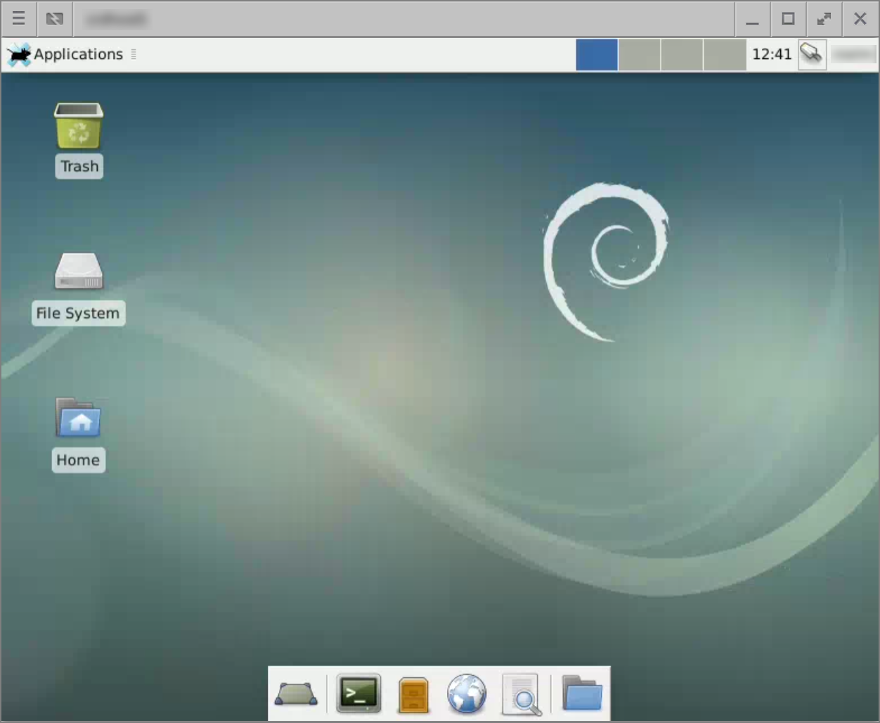 Desktop xfce yang menampilkan taskbar dan panel peluncuran cepat.