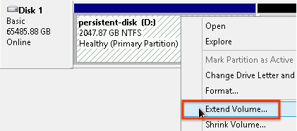 Right-clicking the formatted portion of the disk and selecting the Extend Volume option.