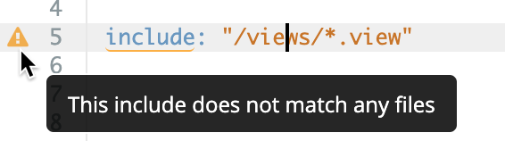 The Looker IDE displays a warning stating that the include does not match any files.